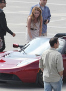 17025913_ZYEQSMWKP - Miley Cyrus Photoshoot in a Tesla Roadster