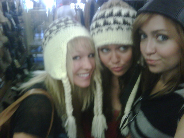 Shoppin at Army Surplus....were diggin these hats!!