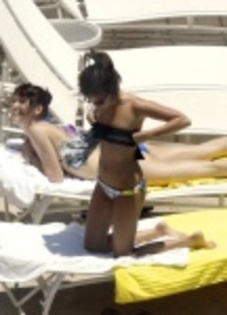 ashley_tisdale_in_bikini_relaxes_poolside_at_her_miami_hotel__jGcVYKB_thumb