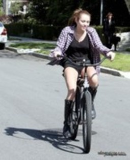 26264025_AFHWMZMRY - x Riding Her Bike in Toluca Lake