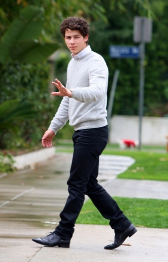 normal_NickGreySweater0306-001 - Nick-waves at the papz as he leaves his house