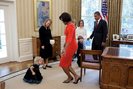 The First Lady curtsies with Lynne Silosky, a niece of posthumous Medal of Honor awardee, Staff Serg