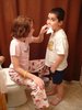 Taking a break from roller skating in the house to pull out my little cousin Joseph's tooth!