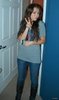 Miley Cyrus gray shirt, tight jeans, boots posing with mom in personal pic2